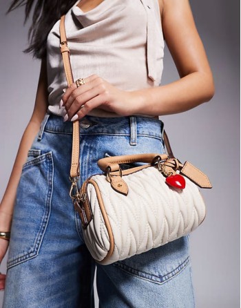 ruched mini bowler bag with charms in cream