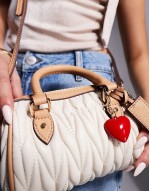 ruched mini bowler bag with charms in cream
