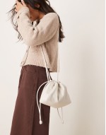 drawstring crossbody bag in off white