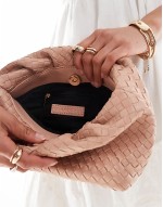 woven clutch bag in beige