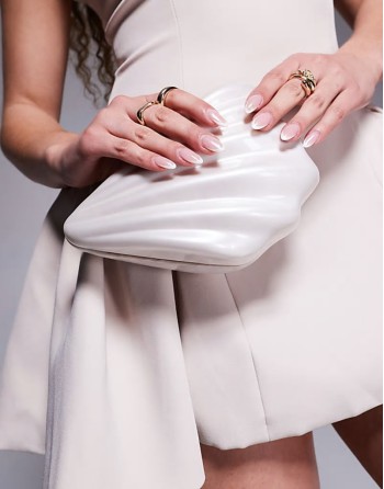 shell clutch bag in cream
